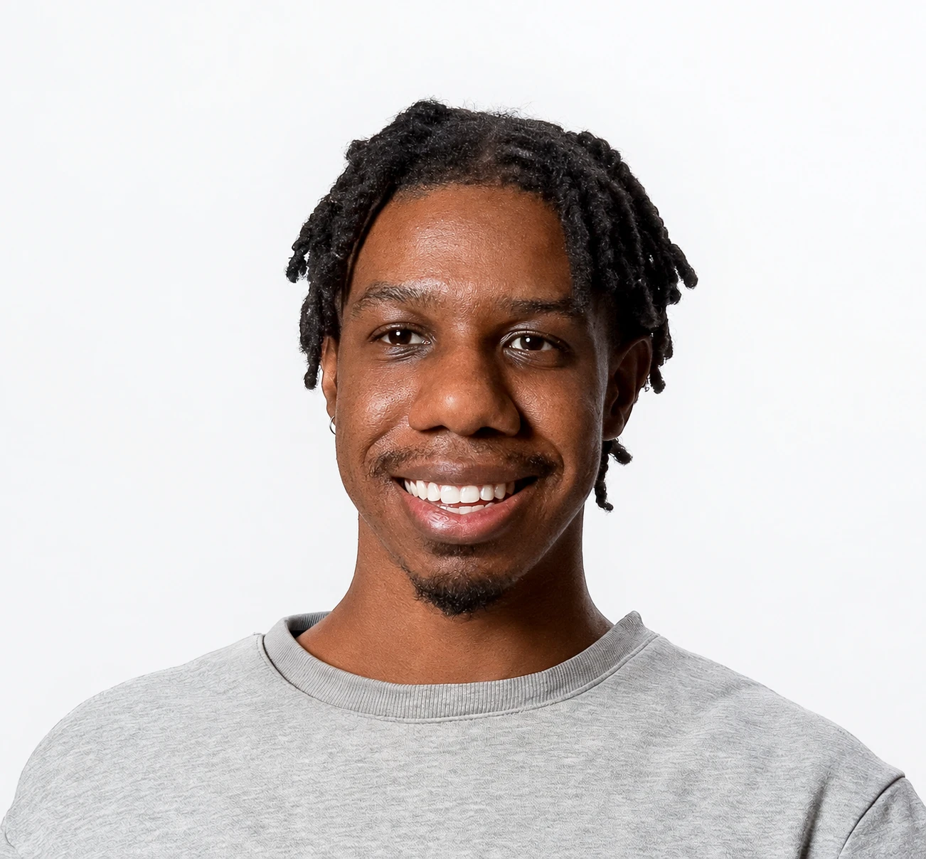 Portrait of Josh Mahaffey, smiling, in a grey sweatshirt